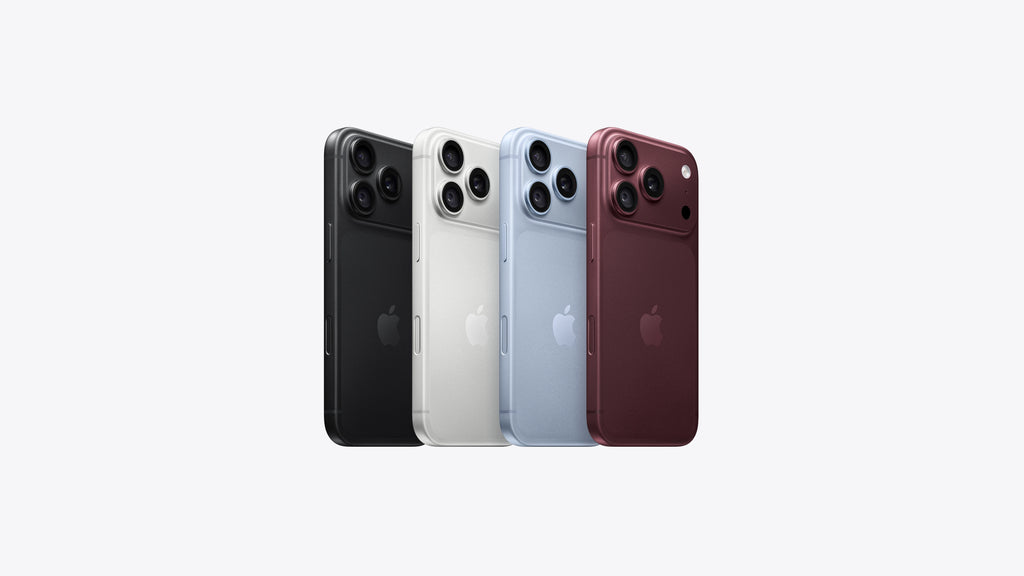 Four Apple iPhone back views shown side by side on a light gray background, in black, white, light blue, and dark red color options.