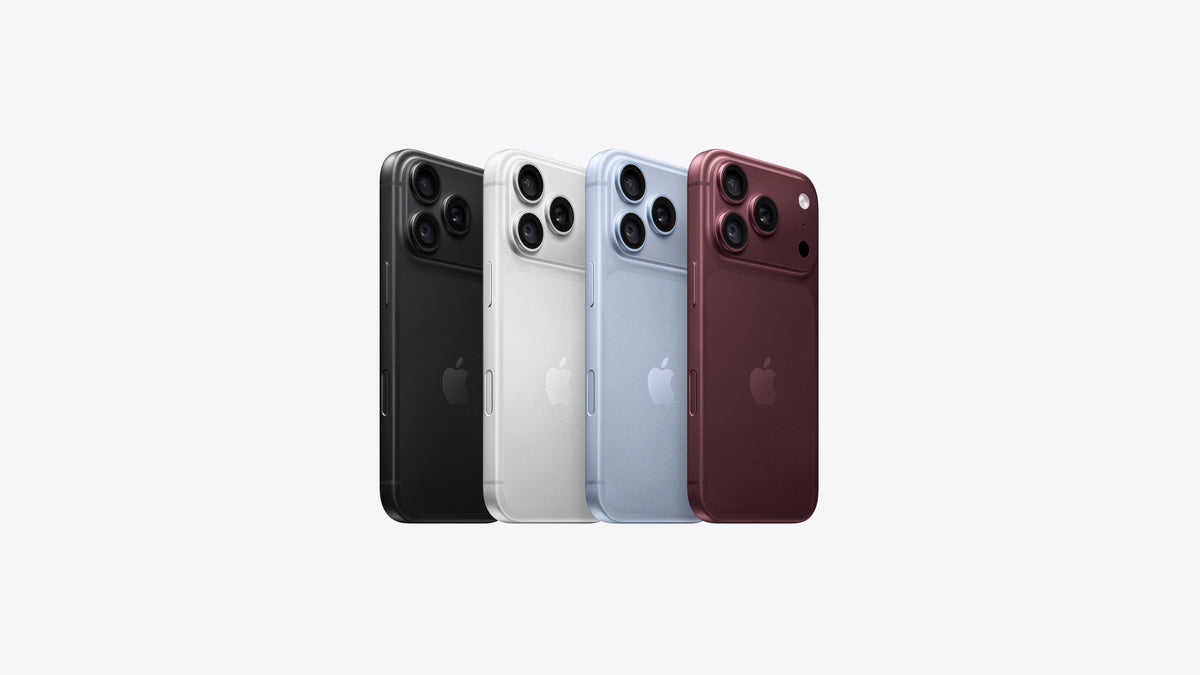 Four Apple iPhone back views shown side by side on a light gray background, in black, white, light blue, and dark red color options.