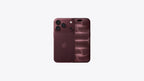 An Apple iPhone shown from the back in a deep plum or burgundy color, featuring a triple-camera system on the left and a subtle wave pattern on the right, set against a plain light gray background.