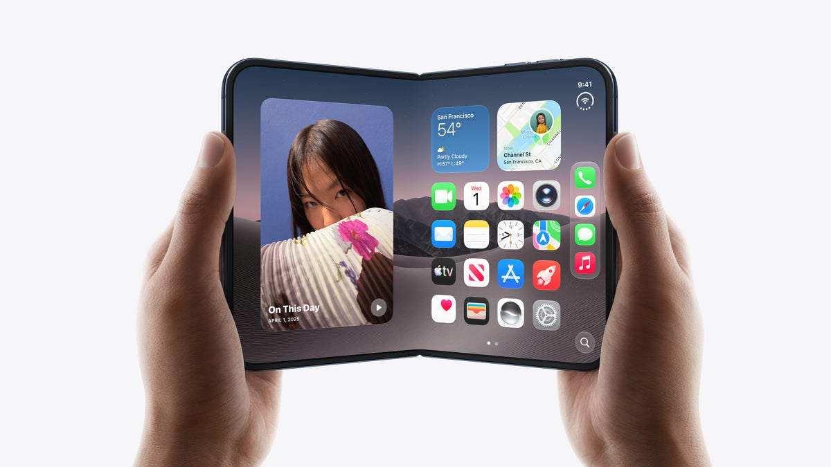 A black foldable smartphone held open in two hands against a clean white background, displaying its software interface on the screens.